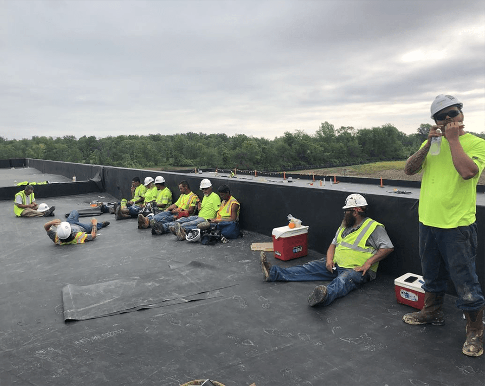 Fydea union roofing crew working together on a commercial roofing project