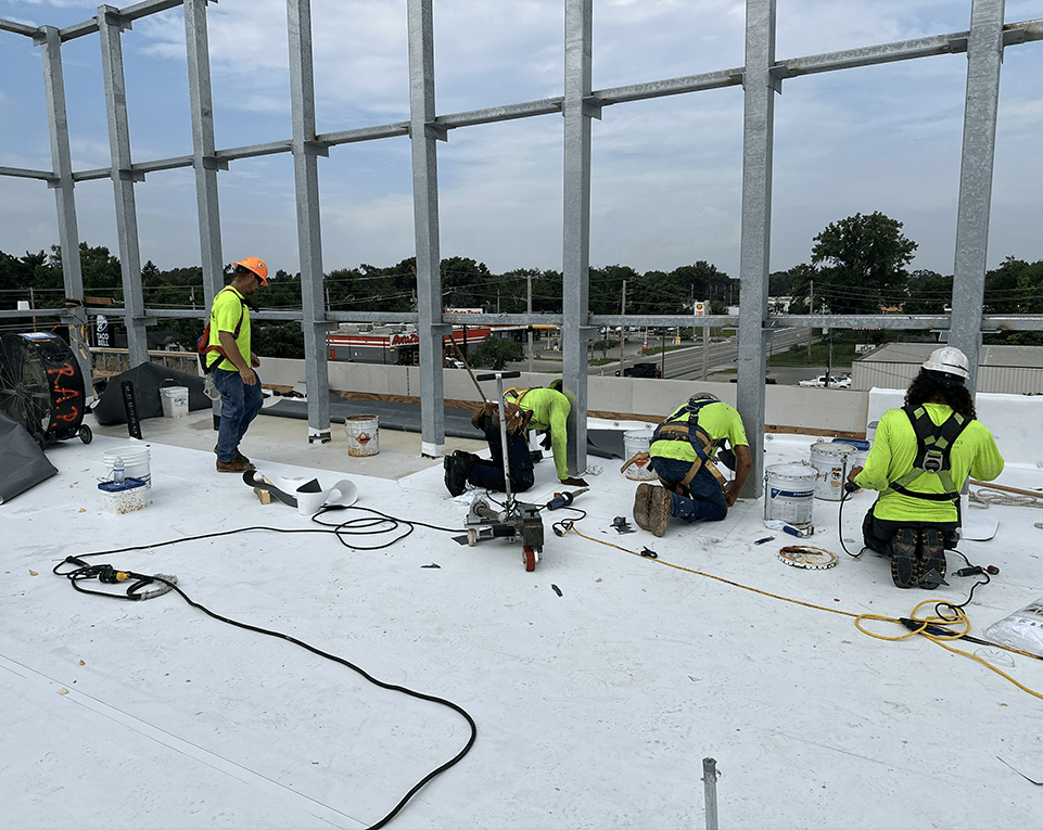 Fydea union roofing crews working on a commercial construction project